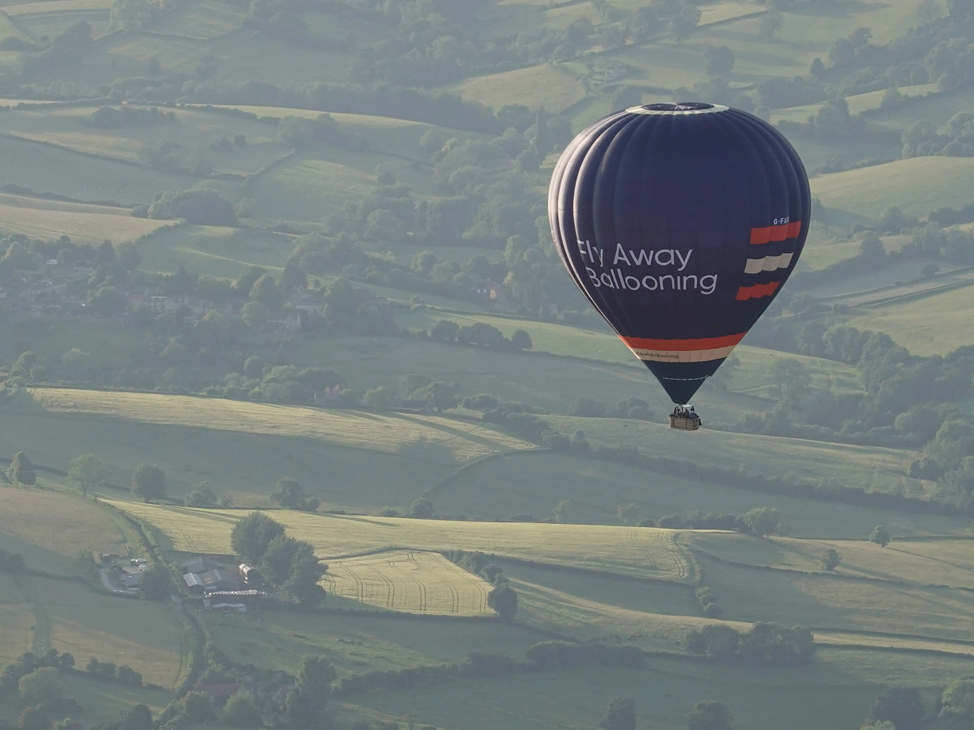 Fly Away Ballooning hot air balloon flying over the Devon countryside near Tiverton