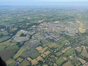 Aerial view of Glastonbury Festival site and surrounding Somerset countryside seen from a hot air balloon