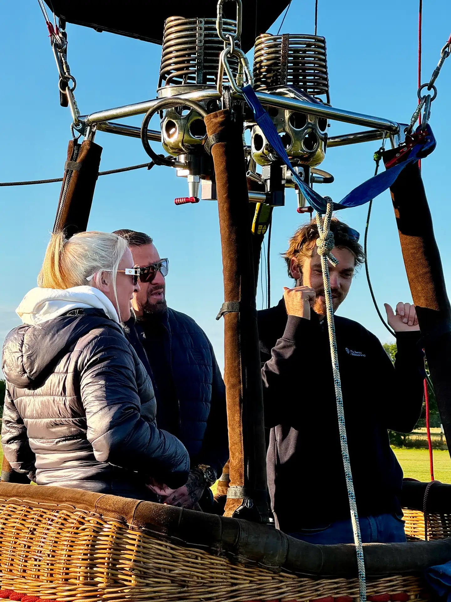 Passengers and pilot in a hot air balloon basket before a balloon flight near Exeter in Devon