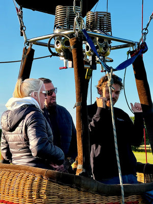 Passengers and pilot in a hot air balloon basket before a balloon flight near Exeter in Devon