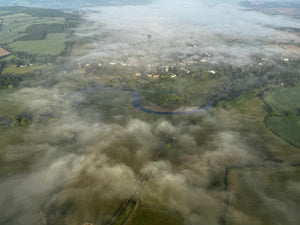 Morning mist over river and countryside seen from a hot air balloon flight near Tiverton Devon