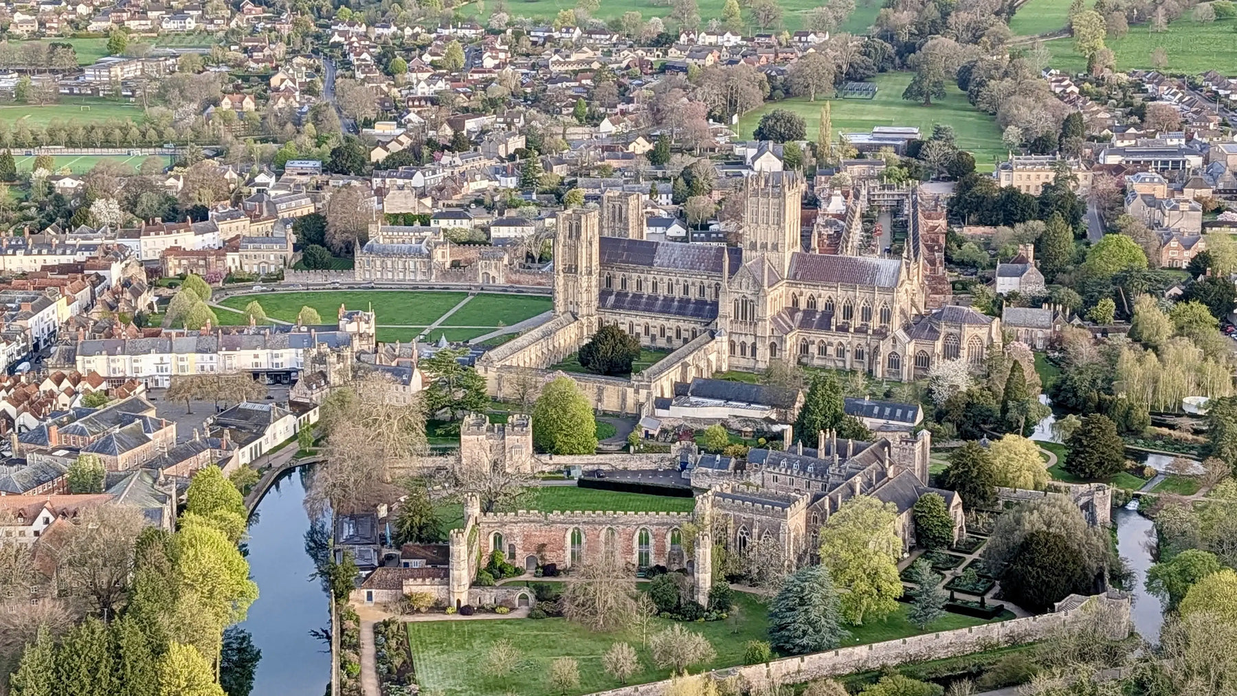 Aerial view of Wells Cathedral and the Bishop’s Palace in Somerset, England, taken from a hot air balloon flight with Fly Away Ballooning.